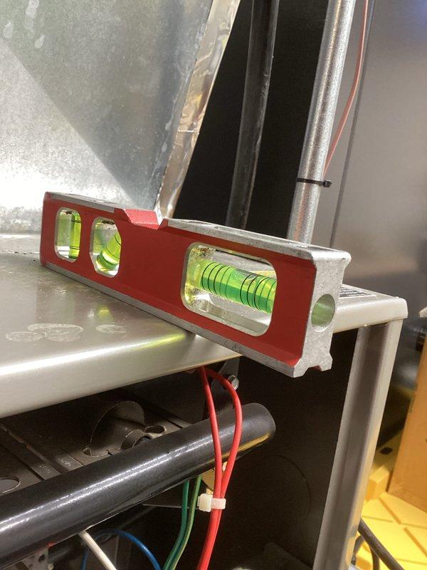 Performed comprehensive tune-up on residential HVAC system, including inspection of furnace interior components, electrical connections, and blower motor assembly. Verified proper leveling of equipment using spirit level to ensure optimal operation and airflow balance. All systems tested and confirmed to be functioning within manufacturer specifications.