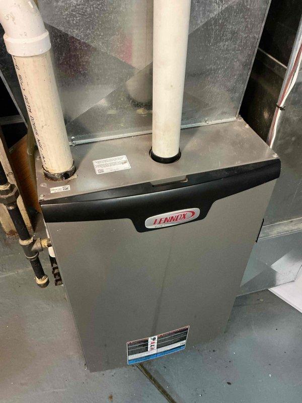 Responded to no-heat service call for a Lennox furnace less than 10 years old. Diagnosed and removed ice buildup in the condensate drain line causing system shutdown. Cleared blockage, verified proper drainage, and confirmed normal system operation with complete heating cycle.