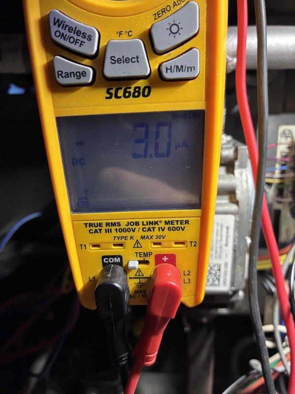 Performed commercial tune-up on Frigidaire high-efficiency (95.0 AFUE) furnace with SmartLite ignition system. Conducted microamp testing with Fieldpiece SC680 multimeter, measuring flame rectification current at -30.0 μA, which falls within manufacturer specifications. Inspected all electrical connections and verified proper operation of heating system components.