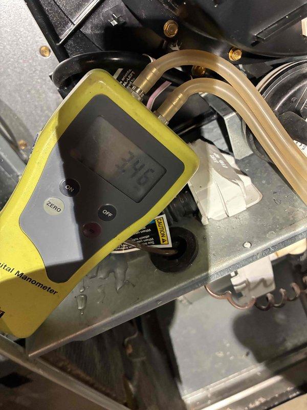 Performed comprehensive HVAC tune-up service on residential furnace system, including inspection of electrical components and control systems with access panel removed. Conducted gas pressure testing using digital manometer, which registered at 3.75" WC, confirming proper gas supply within manufacturer specifications. Inspected all connections, ductwork, and ventilation components, verifying system is operating at optimal efficiency with no safety concerns identified.