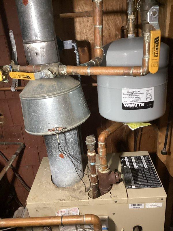 Responded to no heat complaint on newer residential HVAC system. Inspection of utility area revealed issue with expansion tank and circulation system. Serviced the yellow valve assembly on primary piping network and verified proper operation of the WATTS expansion tank. System was restored to normal heating function after adjustments to the boiler connections and circulation components.