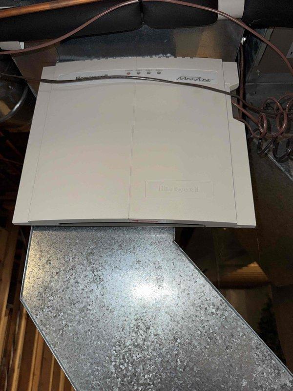 Performed evaluation and installation of new HVAC system in residential basement setting. Replaced existing unit with a new furnace system, including proper connection of ductwork and integration with Honeywell NetAXS control panel. System was tested for proper operation after installation with all components functioning as designed.