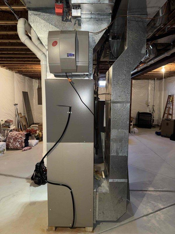 Performed evaluation and installation of new HVAC system in residential basement setting. Replaced existing unit with a new furnace system, including proper connection of ductwork and integration with Honeywell NetAXS control panel. System was tested for proper operation after installation with all components functioning as designed.