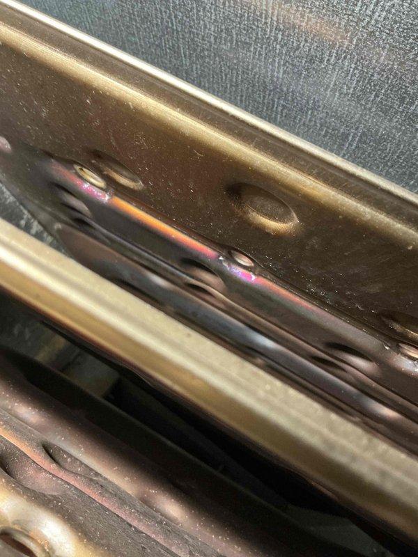Conducted routine prepaid maintenance service on HVAC system. Inspected heat exchanger which showed normal heat discoloration patterns with iridescent coloring typical of proper operation. Verified integrity of metal components and confirmed all mounting hardware was secure.
