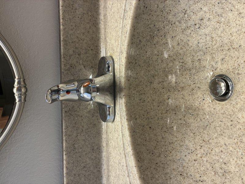 Successfully replaced bathroom sink faucet, installing a new single-handle chrome model with temperature indicators. Verified proper connection of supply lines to existing copper pipes and ensured P-trap assembly was secure with no leaks. System tested and functioning correctly.
