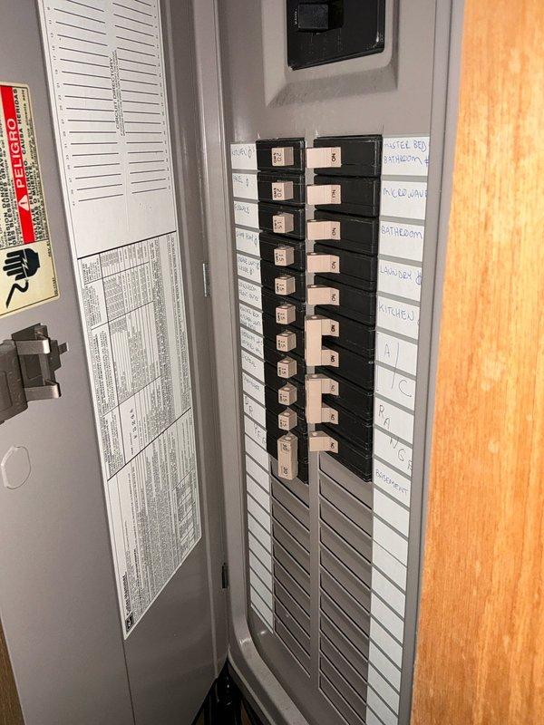 Performed comprehensive assessment of existing HVAC system located in utility area, noting installation configuration with galvanized ductwork connections and PVC ventilation components. Inspected electrical panel to verify appropriate circuit capacity for potential replacement unit, confirming proper labeling and accessibility of dedicated HVAC breakers.