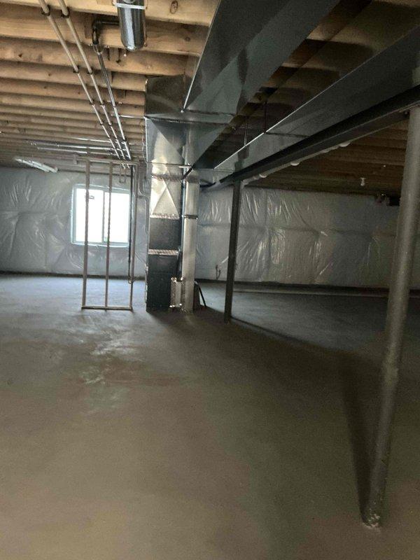 Conducted comprehensive assessment of basement HVAC system, focusing on indoor air quality factors. Inspected exposed ductwork throughout unfinished basement area and evaluated the furnace unit with associated PVC ventilation piping. Documented existing vapor barrier installation and ventilation pathways for potential IAQ improvement recommendations.