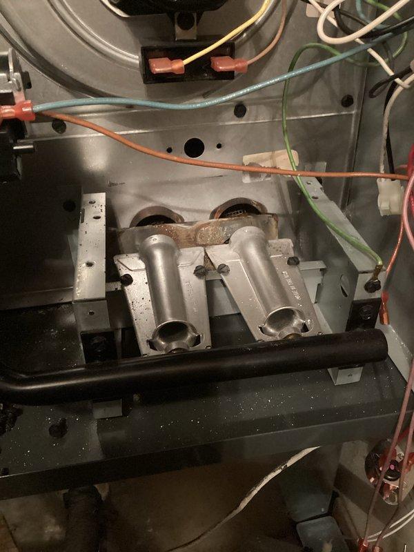 Diagnosed and repaired furnace with no heat issue. Inspection revealed damaged heat exchanger with corrosion and cracked burner tubes, along with disorganized wiring causing intermittent electrical problems. Replaced heat exchanger assembly, rewired electrical connections to factory specifications, and performed complete system test to verify proper operation.