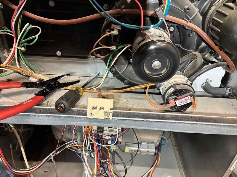 Diagnosed and repaired faulty wiring connections at the gas valve of a newer furnace that was not producing heat. Inspection revealed loose and improperly terminated control wires at the valve, causing intermittent operation. Rewired connections using proper termination methods and verified proper system operation through complete heating cycle testing.