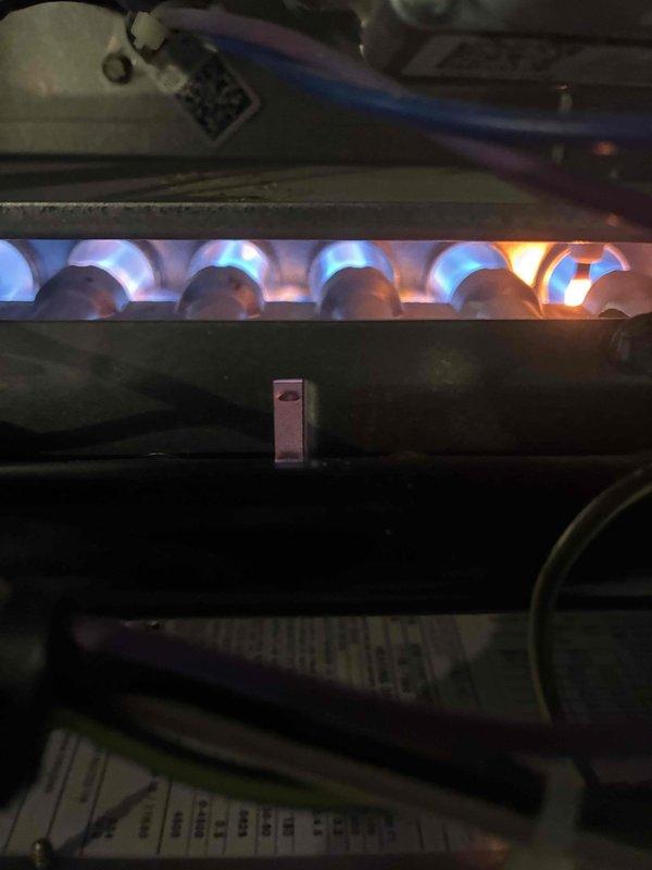 Performed routine tune-up on Concord furnace system located in basement utility room. Inspected burner assembly and verified proper blue flame pattern across all burners, indicating complete combustion. Checked all ductwork connections and system components for proper installation and operation.