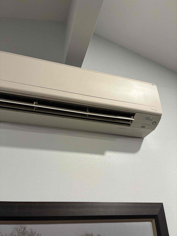 Responded to service call regarding mini-split AC system. Inspected wall-mounted indoor unit and examined electrical connections in the control box. Found loose wiring in terminal block which was causing intermittent operation. Secured all connections and verified proper wire routing. System tested operational with normal airflow and temperature differential.