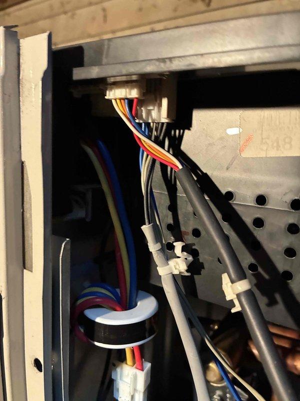 Responded to service call regarding mini-split AC system. Inspected wall-mounted indoor unit and examined electrical connections in the control box. Found loose wiring in terminal block which was causing intermittent operation. Secured all connections and verified proper wire routing. System tested operational with normal airflow and temperature differential.