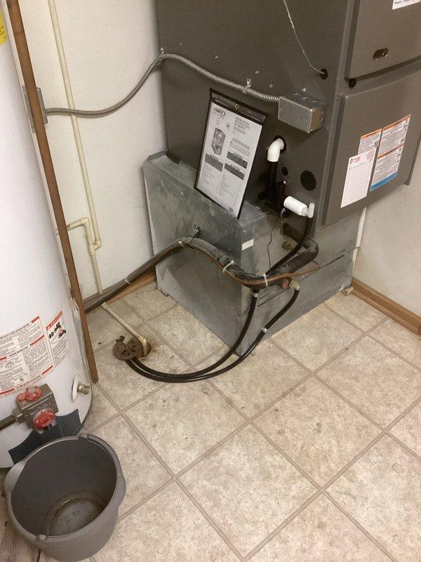 Successfully installed a new Lennox furnace unit in the utility area, including proper connection of PVC ventilation pipes and electrical components. System includes integrated air filtration with all manufacturer specifications followed and safety labels properly affixed.