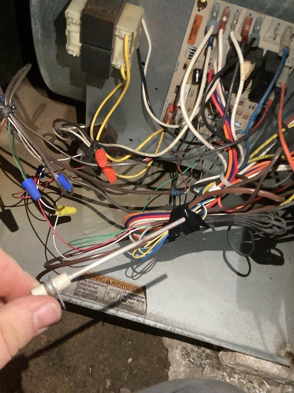 Performed comprehensive tune-up on aging furnace system. Identified significant corrosion and rust accumulation on burner tubes requiring immediate attention. Inspected electrical components, finding disorganized wiring with multiple connection issues that posed potential safety hazards. Cleaned burner assembly, restored proper wire connections, and verified system operation to restore safe functionality.