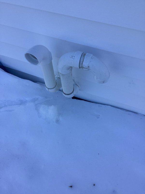 Responded to service call regarding HVAC condensate drainage issues. Upon inspection, identified ice formation on exterior PVC condensate drain pipes due to winter conditions. Cleared ice blockage and verified proper drainage function to prevent system backup and potential damage.