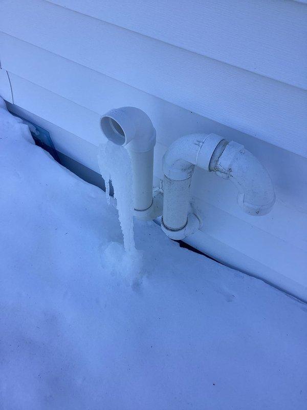 Responded to service call regarding HVAC condensate drainage issues. Upon inspection, identified ice formation on exterior PVC condensate drain pipes due to winter conditions. Cleared ice blockage and verified proper drainage function to prevent system backup and potential damage.