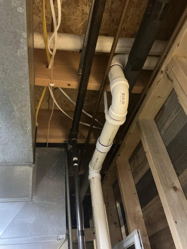 Completed prepaid maintenance service on residential gas furnace. Removed access panels to inspect internal components including control board, gas valve assembly, and electrical connections. System appears to be properly installed with appropriate PVC venting and accessible service clearances.