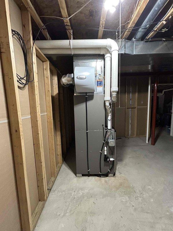 Successfully installed a complete Carrier HVAC system in the client's unfinished basement utility area. The installation included proper mounting of the furnace unit, connection to the existing PVC ductwork system, and verification of all electrical connections. System was tested and confirmed to be operating according to manufacturer specifications.