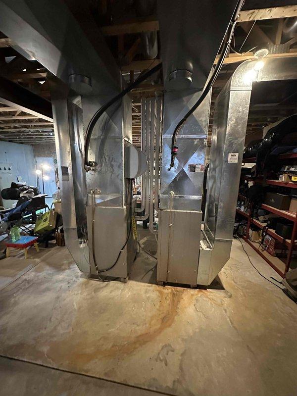 Conducted comprehensive assessment of existing HVAC system in basement utility area. Evaluated aging furnace unit with connected rectangular galvanized ductwork system. Recommended full system replacement due to visible wear patterns and potential efficiency concerns. Detailed specifications for appropriate replacement equipment that would integrate with existing duct configuration while improving overall system performance.