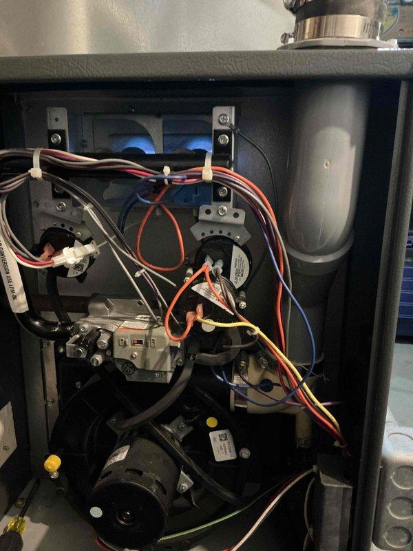 Responded to a no-heat call for a Goodman furnace under 10 years old. Upon inspection, removed access panel to examine internal components including ignition assembly and wiring. Diagnosed and resolved issue with the gas burner system, restoring proper heating function to the unit.