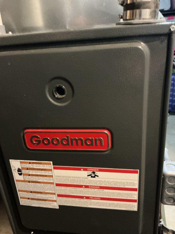 Responded to a no-heat call for a Goodman furnace under 10 years old. Upon inspection, removed access panel to examine internal components including ignition assembly and wiring. Diagnosed and resolved issue with the gas burner system, restoring proper heating function to the unit.