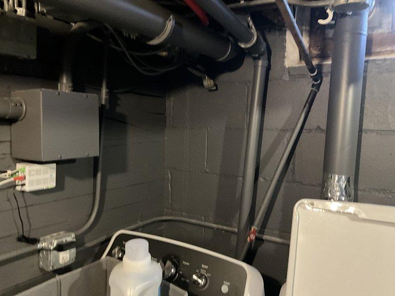 Conducted site assessment for mini split installation in residential basement utility area with existing mechanical systems and exterior access point. Evaluated electrical supply requirements, identified suitable locations for indoor air handler in utility room and outdoor condenser unit near entrance. Documented snow conditions that will require consideration during installation planning.