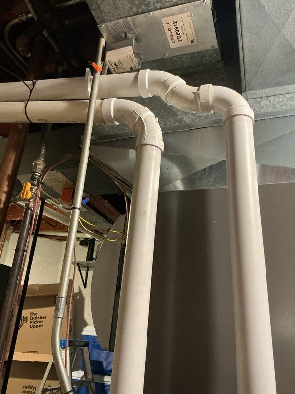 Performed routine tune-up on Lennox HVAC system, inspecting both the furnace unit and associated humidifier/air purifier component. Checked PVC ventilation piping for proper installation and verified drainage system functionality. Conducted visual inspection of ductwork connections and electrical components, confirming all systems are operating within normal parameters.