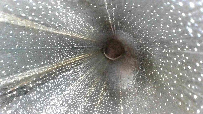 Performed comprehensive inspection of ventilation system, identifying significant dust accumulation and particulate matter throughout the ductwork. Photos revealed extensive white speckled debris adhering to interior duct surfaces, potentially restricting airflow and affecting system efficiency. Thoroughly cleaned all accessible ductwork to restore proper ventilation and improve indoor air quality.