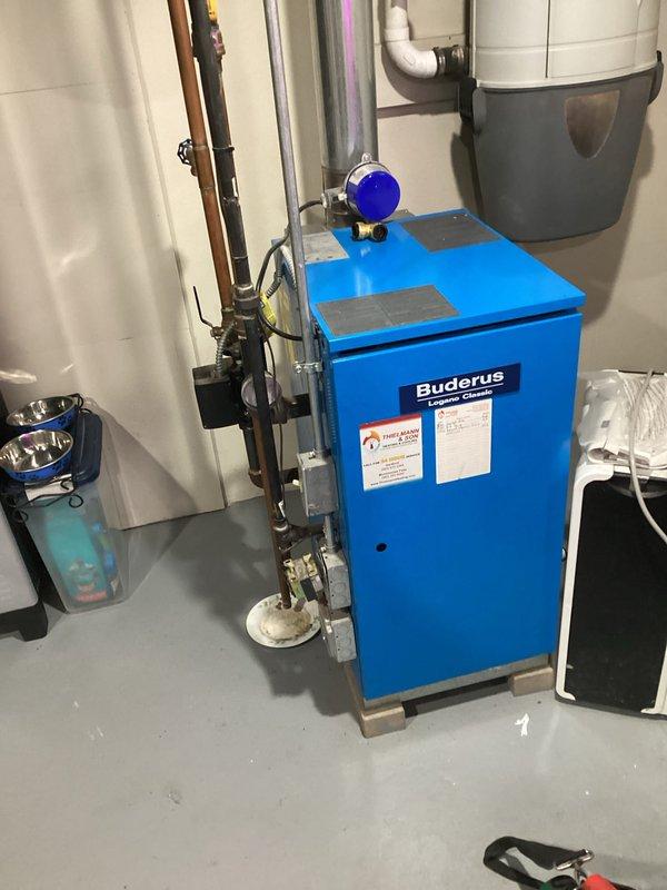 Performed routine service on Buderus boiler system. Inspected Amtrol Extrol expansion tank and associated copper piping network for proper function. Verified all valves and connections were secure with no leaks present throughout the heating system.