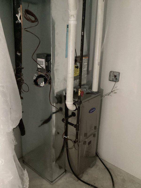 Successfully installed a new Carrier furnace system in the client's utility room, including proper connection of PVC ventilation pipes and integration with the existing ductwork. Completed the installation with a digital thermostat mounted in the living space and verified proper system operation before finalizing the job.