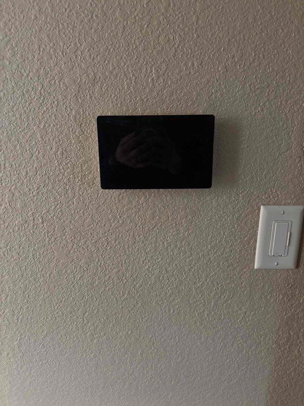 Successfully installed a complete HVAC system including a Goodman furnace with proper sheet metal ductwork connections in the utility room. System installation included mounting the digital thermostat control panel on the main living area wall and verifying all components were operational after installation.