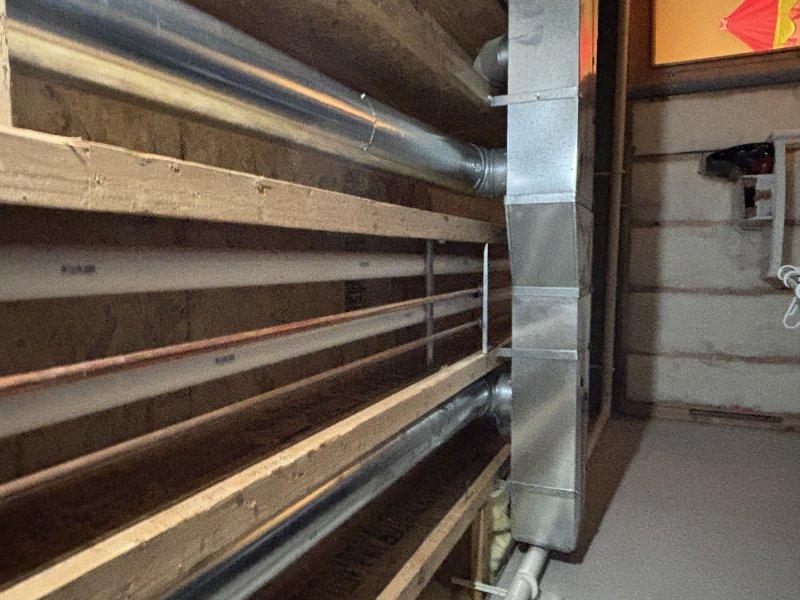 Completed tankless water heater installation with proper venting through exterior wall. Installed PVC condensate drain line with appropriate slope and secured to building exterior. Connected copper supply lines to unit and verified all connections for leaks. System tested and functioning at optimal efficiency with no issues observed.