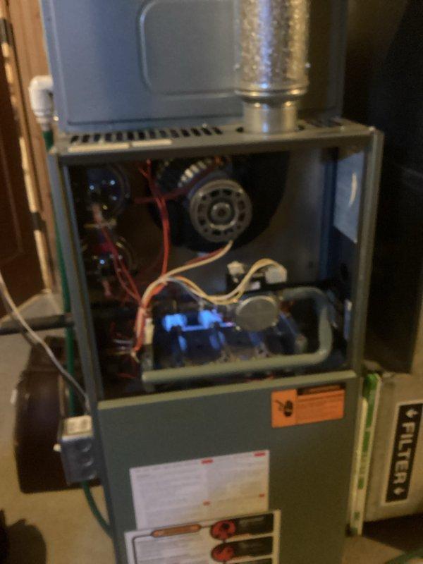 Performed routine tune-up service on customer's furnace system, including inspection of internal components and electrical connections. Removed front panel to access and clean blower motor assembly and verify proper operation of circuit board. Conducted electrical testing to ensure all components are functioning within manufacturer specifications, confirming system is operating safely and efficiently.