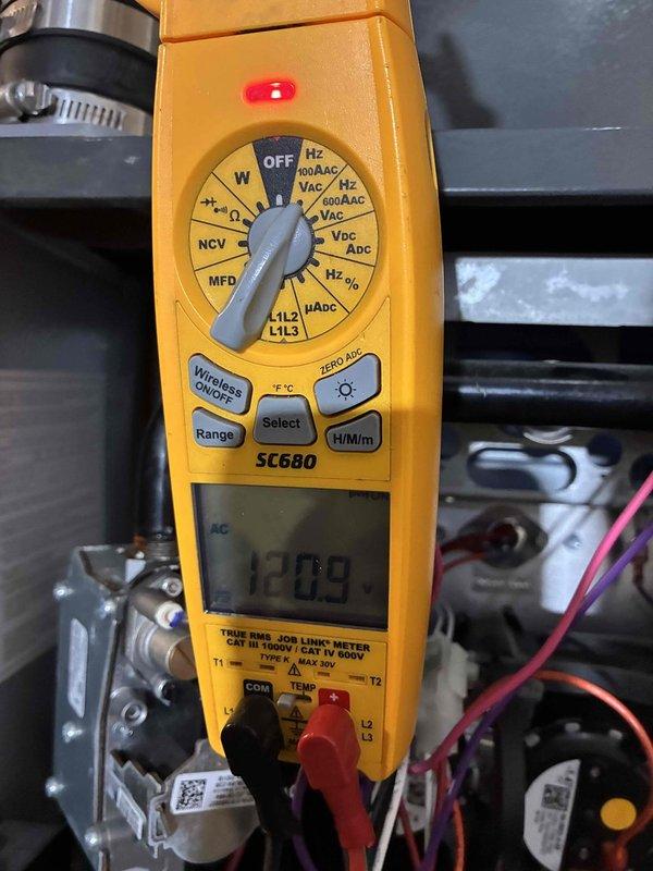 Diagnosed no-heat complaint on system less than 10 years old. Performed electrical testing with Fieldpiece SC680 multimeter, measuring approximately 1209 ohms through control circuit. Inspected temperature sensor probe installation in insulated line set to verify proper operation. System restored to normal heating function after completing diagnostic checks.