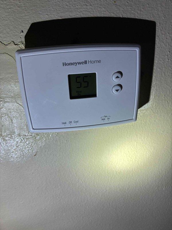 Responded to service call for bathroom plumbing issues. Removed faulty sink fixture and cleaned accumulated residue from basin. Inspected Honeywell Home thermostat which was set to 55 degrees and verified proper operation of heat/cool modes and temperature adjustment functions.