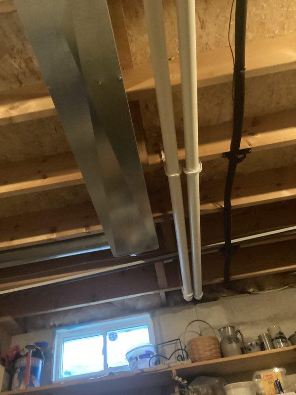 Performed routine HVAC tune-up using dual port manometer to test system pressure readings (352/287), verifying proper operation within manufacturer specifications. Inspected basement ductwork configuration and PVC exhaust/intake piping for integrity and proper installation, confirming all components are functioning correctly with no issues detected.