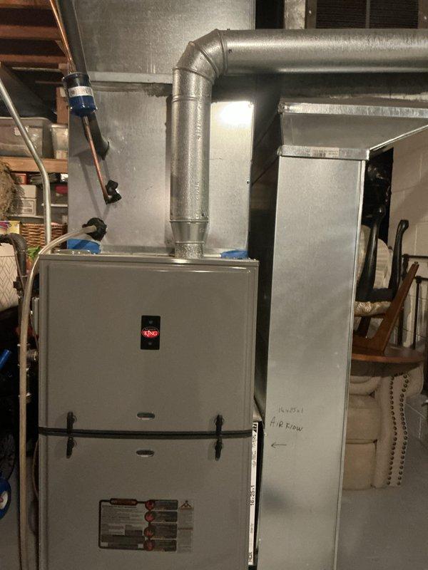 Performed routine tune-up service on a Rheem HVAC system located in the basement. Inspected and cleaned the blower assembly which showed minor dust accumulation but was in functional condition. Examined the furnace unit, ductwork connections, and verified proper airflow direction as indicated on the return duct markings. System is operating within normal parameters following service.