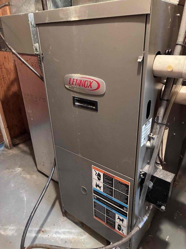 Performed routine maintenance on Lennox furnace system. Cleaned significant dust accumulation from blower assembly and housing to improve airflow efficiency. Inspected PVC ventilation connections and verified proper system operation.
