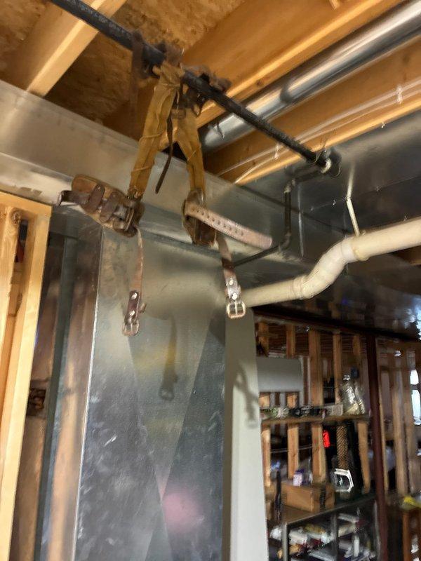 Conducted inspection of existing gas line system in unfinished basement area. Evaluated ductwork mounting, support straps, and connection points. Assessed plumbing components including copper pipe configuration, PVC drainage, and PEX tubing installation. Documentation completed with photos showing current system layout for future reference.