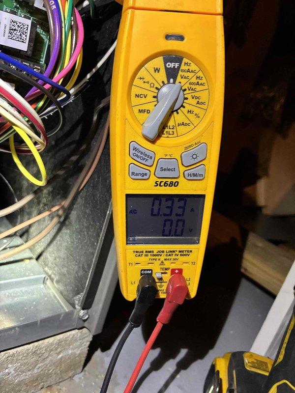 Performed routine HVAC tune-up service which included inspection and replacement of air filter with new pleated filter. Conducted electrical system diagnostics using SC680 multimeter, checking voltage readings (0.33V) at the control board to verify proper electrical connections and component functionality.