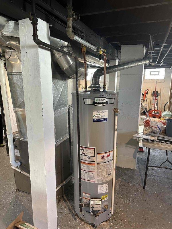 Conducted assessment of existing HVAC system in basement utility room, including Smith water heater and furnace with connected PVC ventilation. System evaluation revealed need for complete replacement of aging equipment. Documented current configuration of ductwork, water connections, and ventilation requirements to prepare comprehensive replacement estimate.