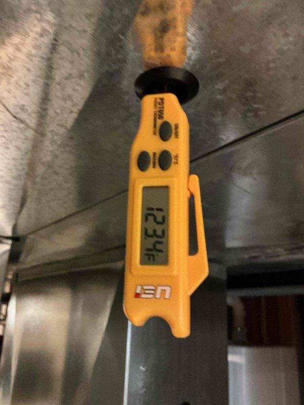Performed comprehensive HVAC tune-up service on aging furnace system, noting significant oxidation and rust buildup on copper components. Conducted diagnostic testing with digital measurement tool, recording temperature readings of 234°F, which falls within acceptable operational parameters. Inspected all electrical connections, examined gas valve assembly functionality, and verified proper operation of all mechanical components despite visible wear on the system.