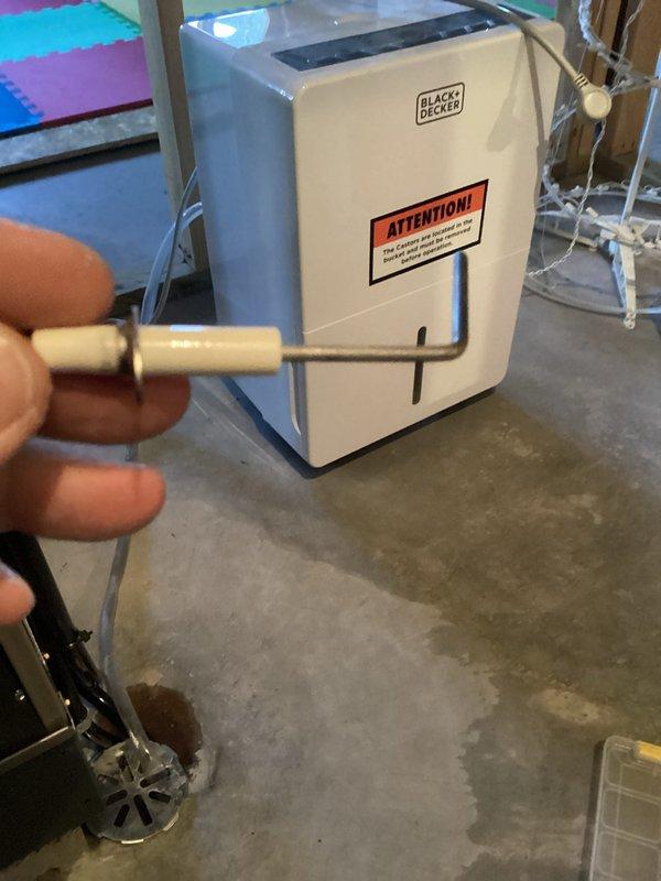 Performed routine preventative maintenance on customer's dehumidifier system. Inspected drainage setup and identified moisture accumulation around drain pan. Cleared clogged condensate drain line and verified proper water flow to prevent future backup issues. System now operating at optimal efficiency with proper drainage function restored.