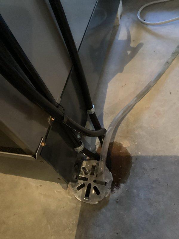 Performed routine preventative maintenance on customer's dehumidifier system. Inspected drainage setup and identified moisture accumulation around drain pan. Cleared clogged condensate drain line and verified proper water flow to prevent future backup issues. System now operating at optimal efficiency with proper drainage function restored.