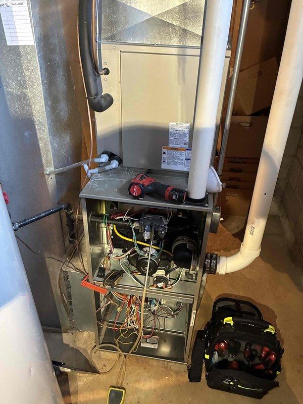 Performed routine maintenance on customer's furnace system. Inspected electrical components and wiring connections with testing probe, ensuring proper voltage readings and secure connections. Examined internal components including circuit boards and mechanical elements, with all systems verified to be operating within manufacturer specifications.