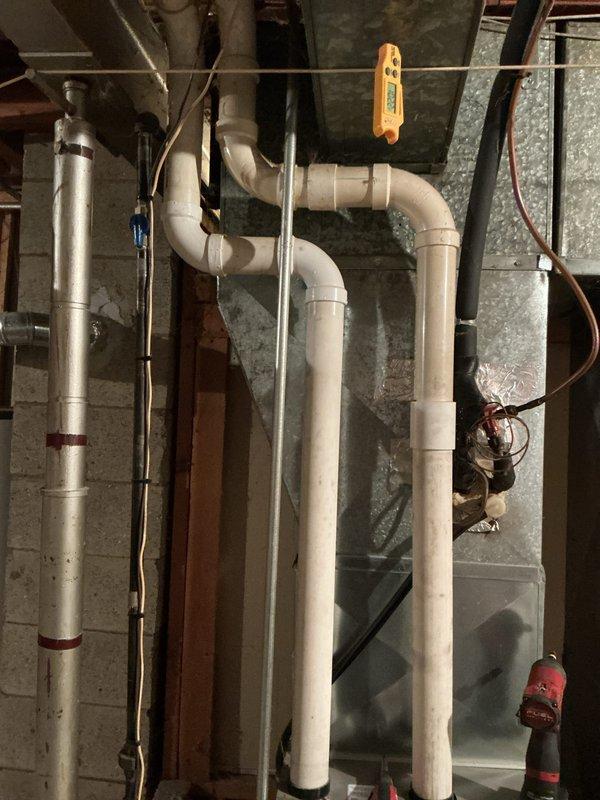 Performed comprehensive tune-up on HVAC system, including inspection and cleaning of the blower wheel which showed significant dust accumulation affecting performance. Examined and evaluated PVC condensate drainage system in utility area, confirming proper installation and function. Removed debris from mechanical components to improve system efficiency and prevent potential blockages.