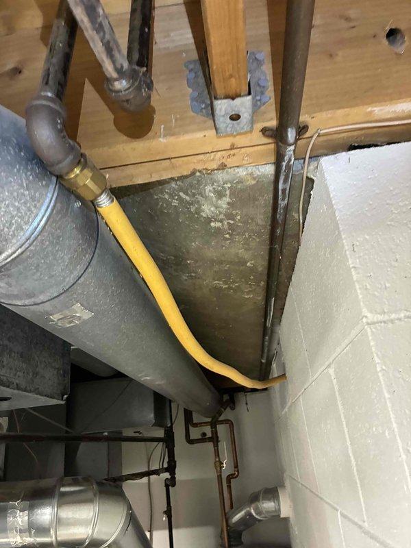 Performed scheduled HVAC maintenance service on residential system. Conducted complete electrical testing using SC680 multimeter, confirming proper amperage readings of 24.3 amps with normal voltage levels. Inspected gas line connections and ductwork in basement mechanical area, all components found in good working condition with no signs of leaks or safety concerns.