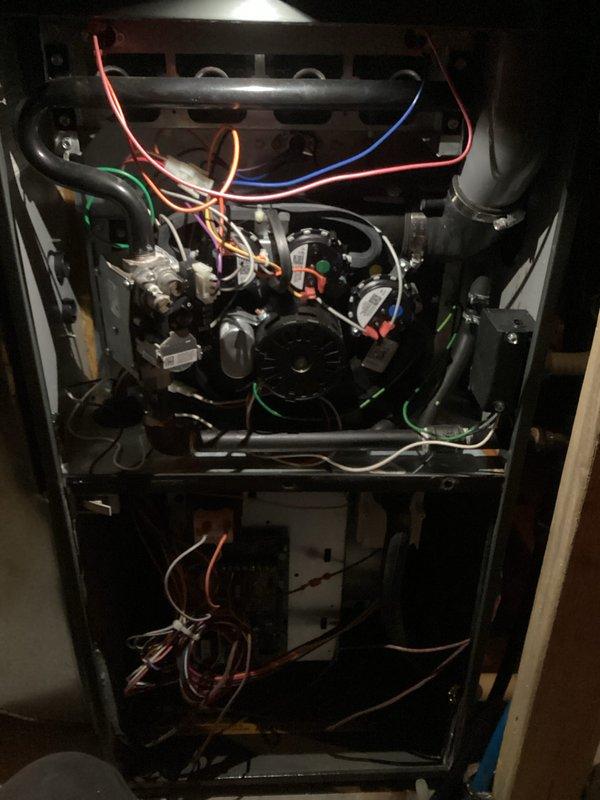 Performed comprehensive HVAC tune-up service including inspection of interior furnace components, verification of proper wiring connections to control board, and examination of heat exchanger integrity. System was leveled using spirit level to ensure optimal operation and proper condensate drainage.