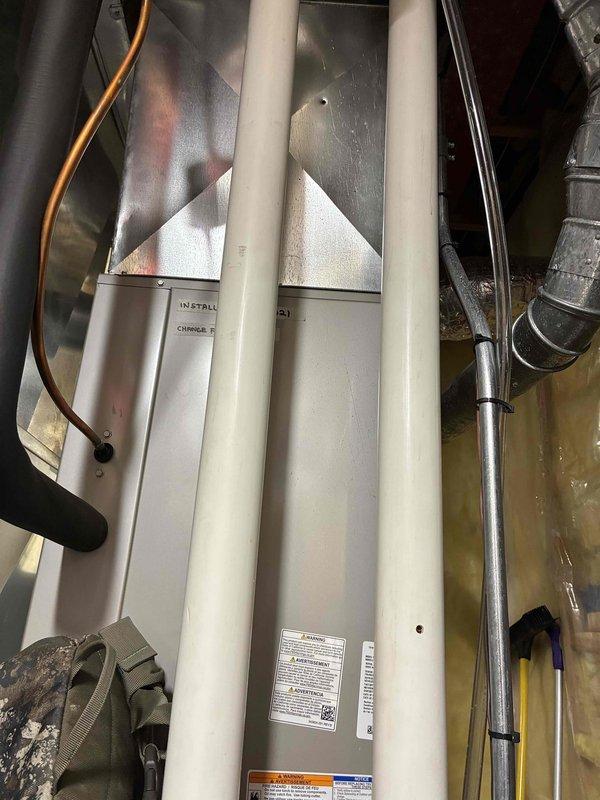 Performed routine maintenance tune-up on customer's HVAC system. Inspected PVC venting pipes, verified proper condensate drainage system operation, and examined internal wiring connections. All components found to be in good working condition with no issues detected.