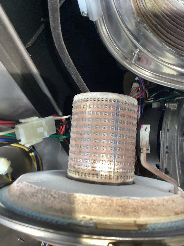 Performed inspection and maintenance service on hydronic boiler system. Accessed internal components including burner assembly, control boards, and circulation system. Verified proper operation of ignition system (observed normal flame pattern) and confirmed all electrical connections were secure with no issues detected in the primary heating elements.